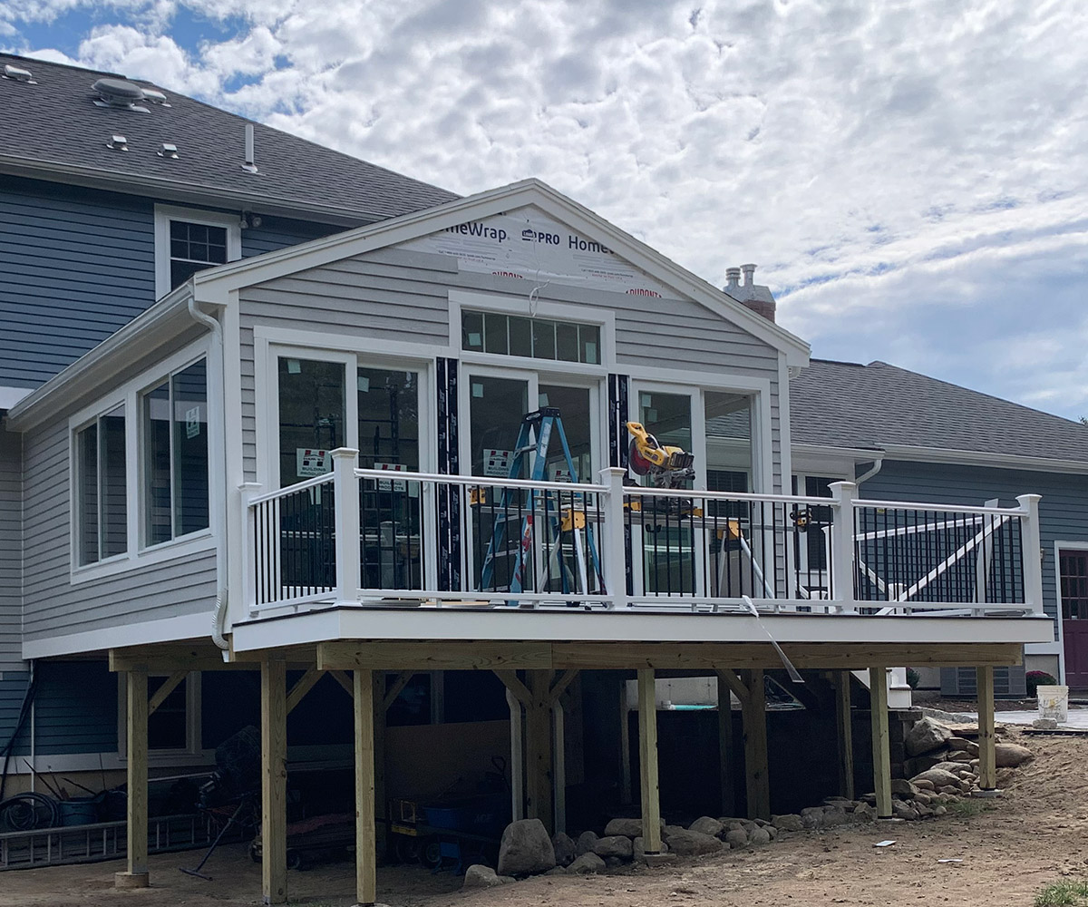 Home featuring a deck and porch, providing a perfect space for relaxation and outdoor activities.